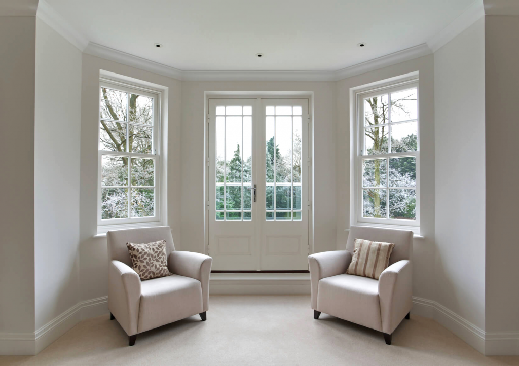 inside view of sash windows with 2 chairs on display